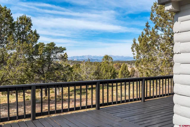 a view of balcony with wooden floor