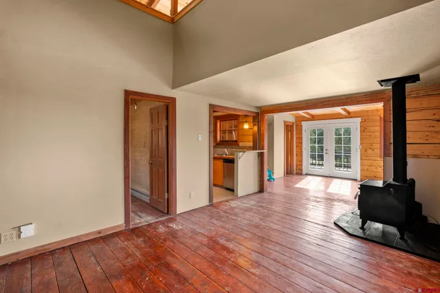 a view of a room with wooden floor and stairs