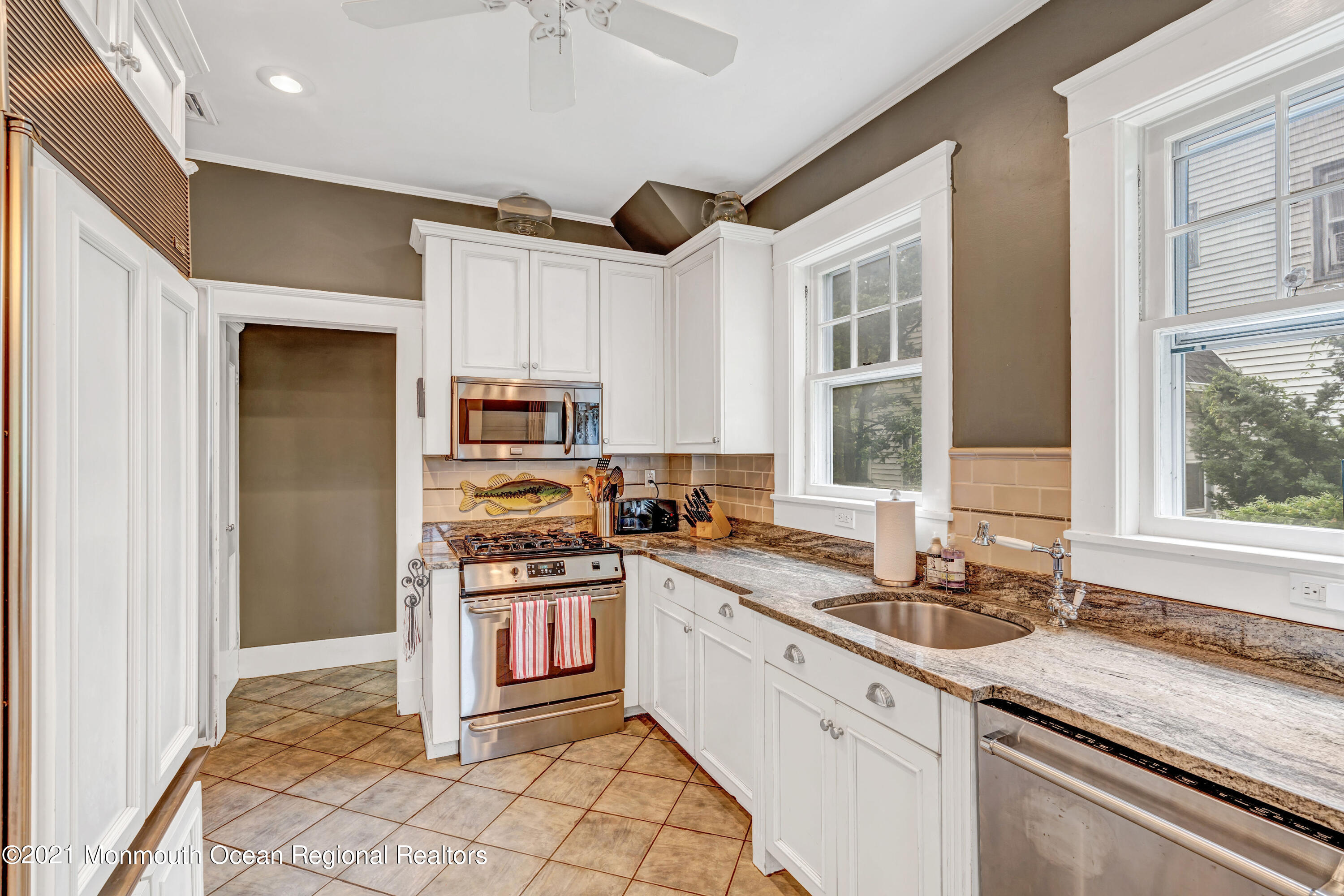 119 Pinckney Road Little Silver, NJ 07739 - Photo 22 of 40 a kitchen with stainless steel appliances granite countertop a stove a sink and a refrigerator