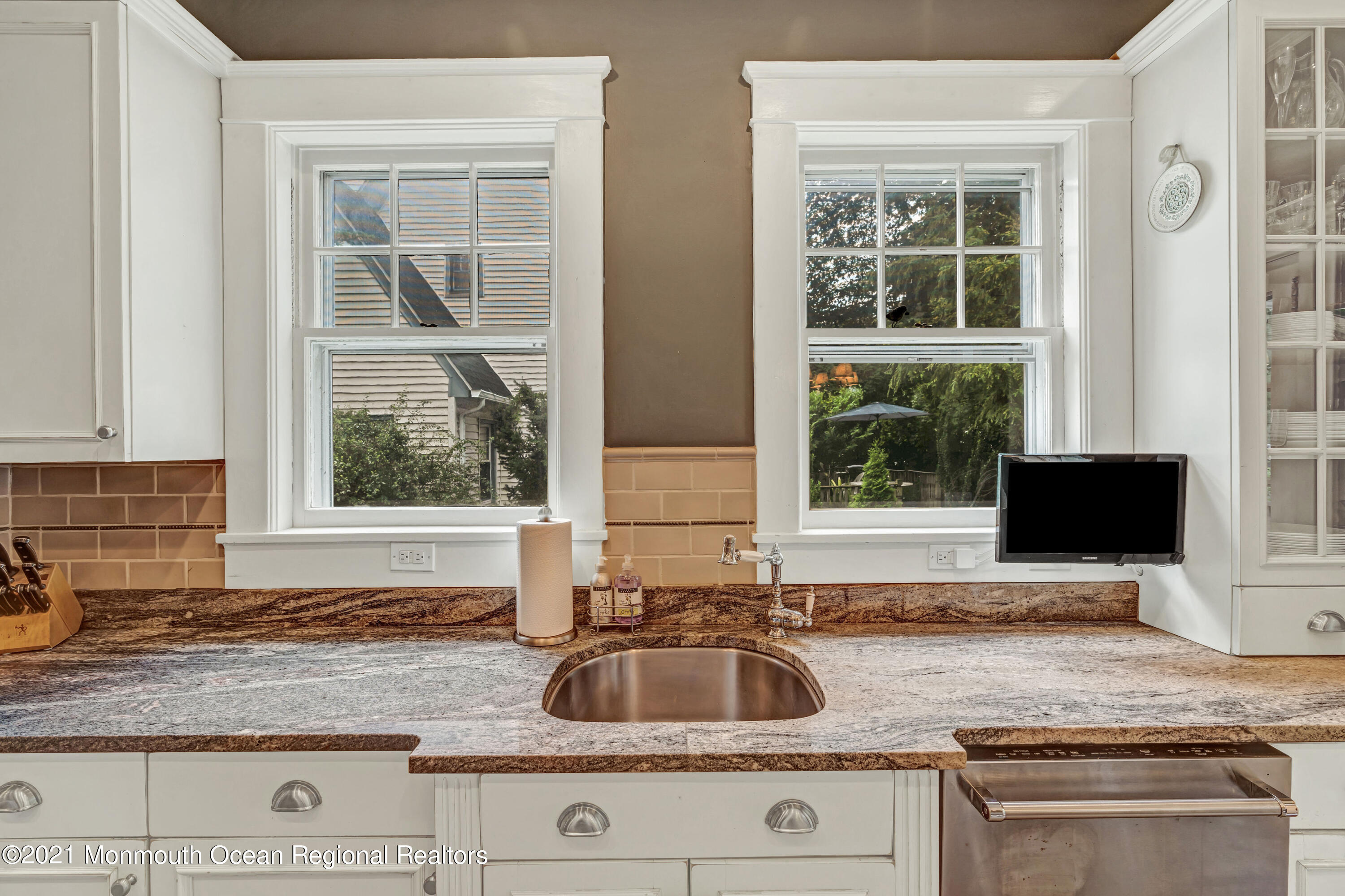 119 Pinckney Road Little Silver, NJ 07739 - Photo 23 of 40 a kitchen with granite countertop a sink and a stove with wooden floor