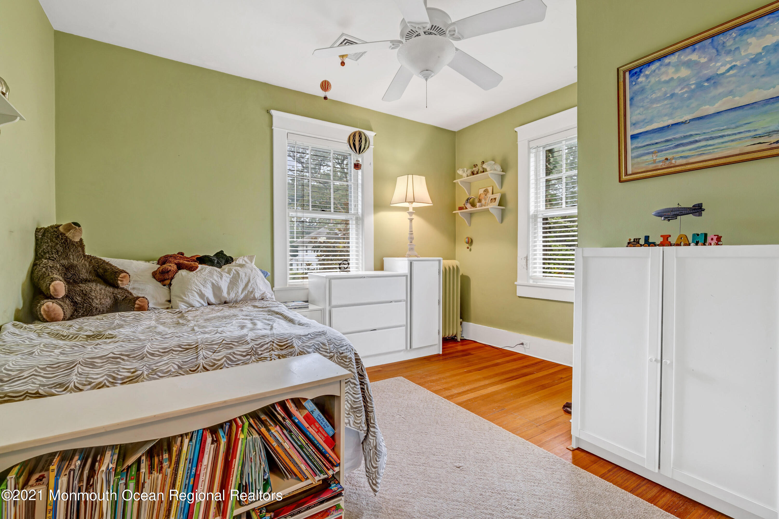 119 Pinckney Road Little Silver, NJ 07739 - Photo 29 of 40 a bedroom with a bed and wooden floor