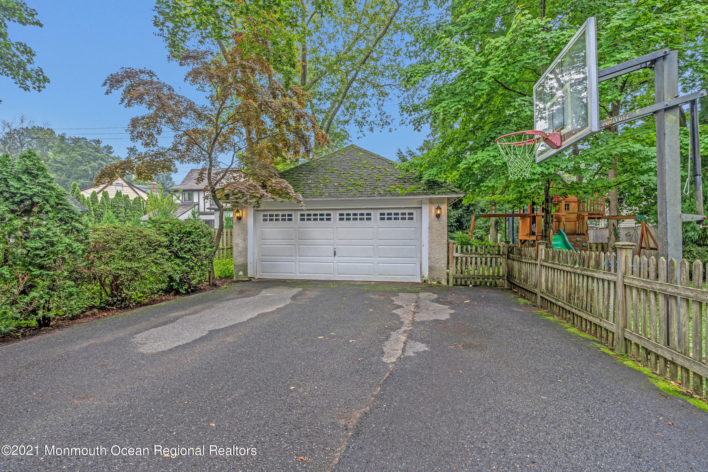 119 Pinckney Road Little Silver, NJ 07739 - Photo 36 of 40 a front view of a house with a yard and garage
