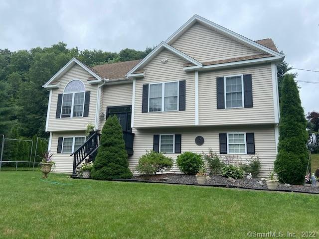 73 Holbrook Road Seymour, CT 06483 - Photo 1 of 1 a front view of a house with a yard and trees
