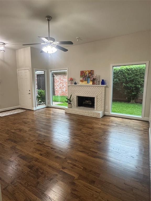 4010 Rive Lane Addison, TX 75001 - Photo 12 of 25 a living room with furniture and a fireplace