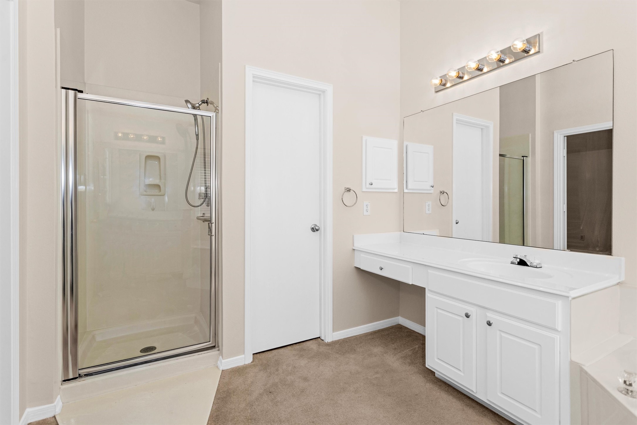 2615 Honeysuckle Walk Spring, TX 77388 - Photo 25 of 39 a bathroom with a shower sink and mirror