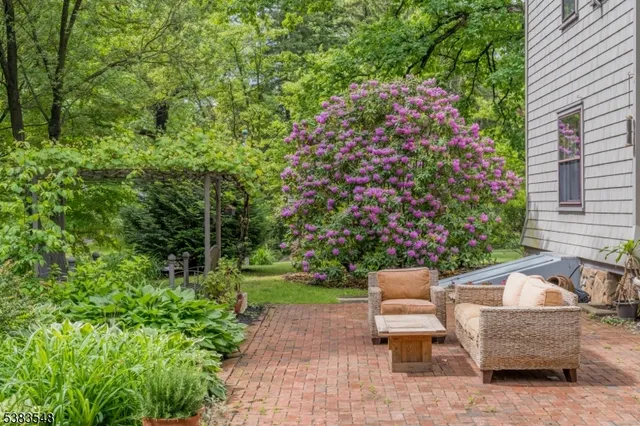 a view of a backyard with sitting area