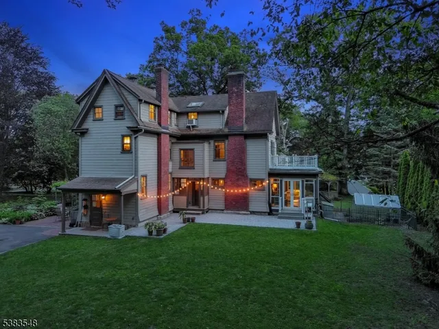 a view of a house with a yard porch and sitting area