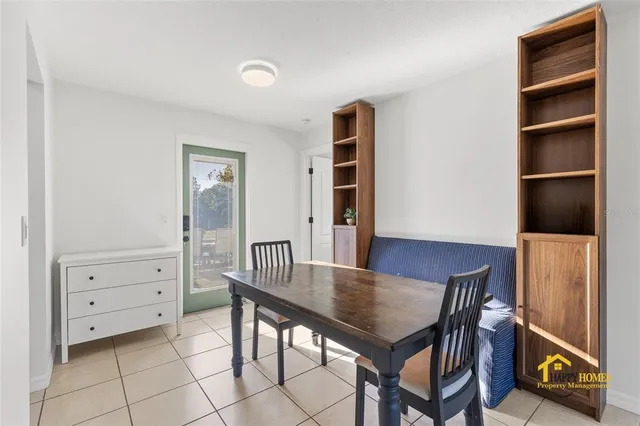 a dining room with furniture and window