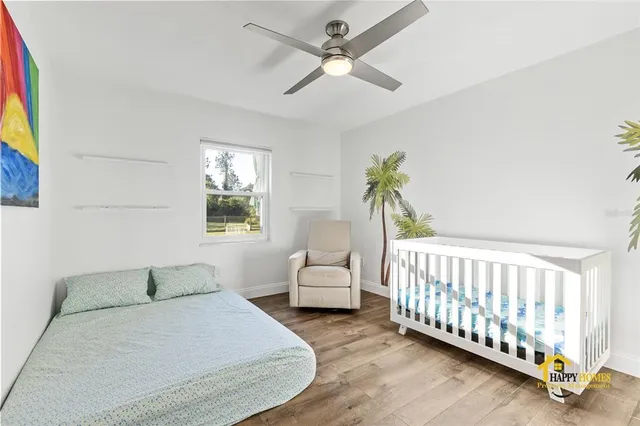 a bathroom with a granite countertop sink mirror vanity and toilet