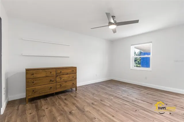 a kitchen with granite countertop white cabinets and sink