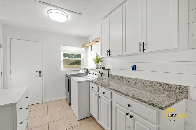 a view of a house with backyard porch and sitting area