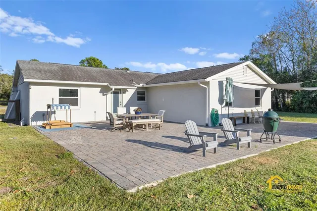 a view of a swimming pool with a yard