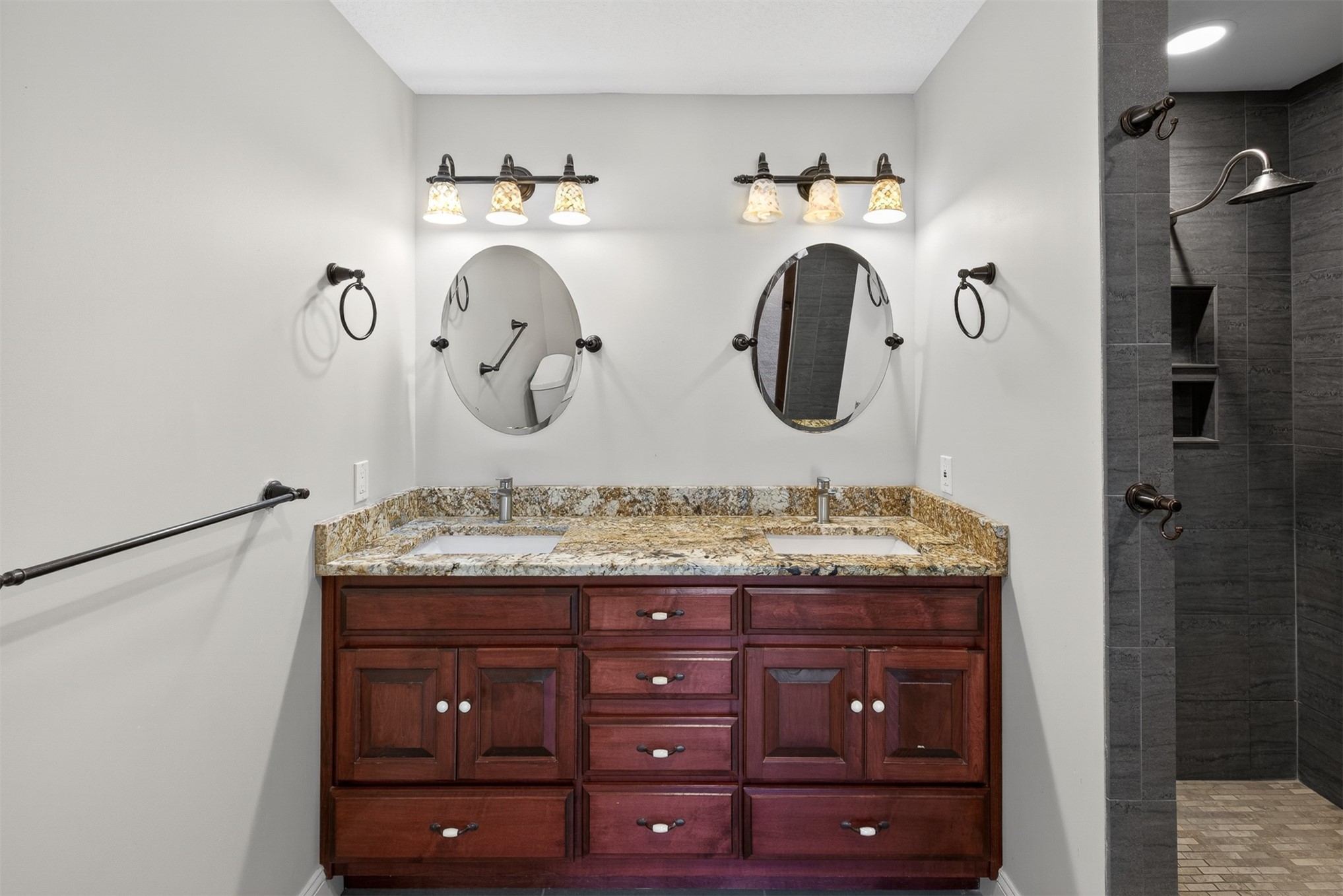 3301 Sea Marsh Road, Unit 3301 Amelia Island, FL 32034 - Photo 25 of 58 a bathroom with a granite countertop sink and a mirror