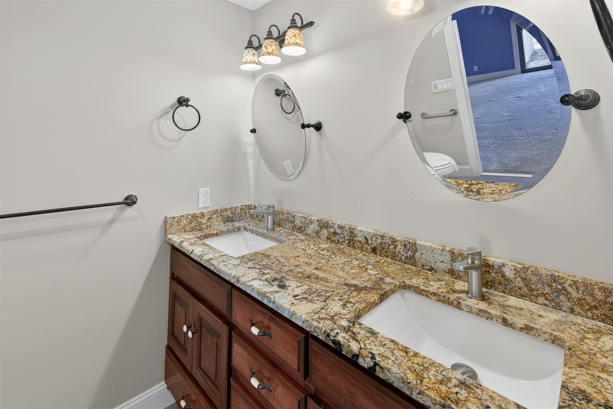 3301 Sea Marsh Road, Unit 3301 Amelia Island, FL 32034 - Photo 26 of 58 a bathroom with a granite countertop sink a mirror and shower