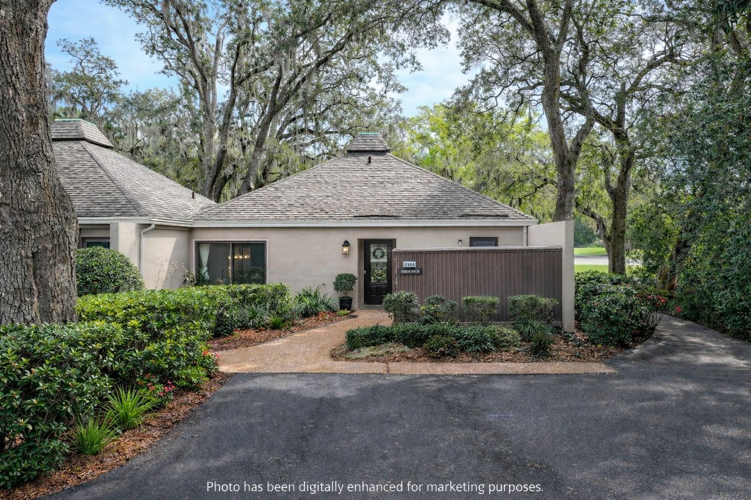 3301 Sea Marsh Road, Unit 3301 Amelia Island, FL 32034 - Photo 3 of 58 a front view of a house with a yard and garage