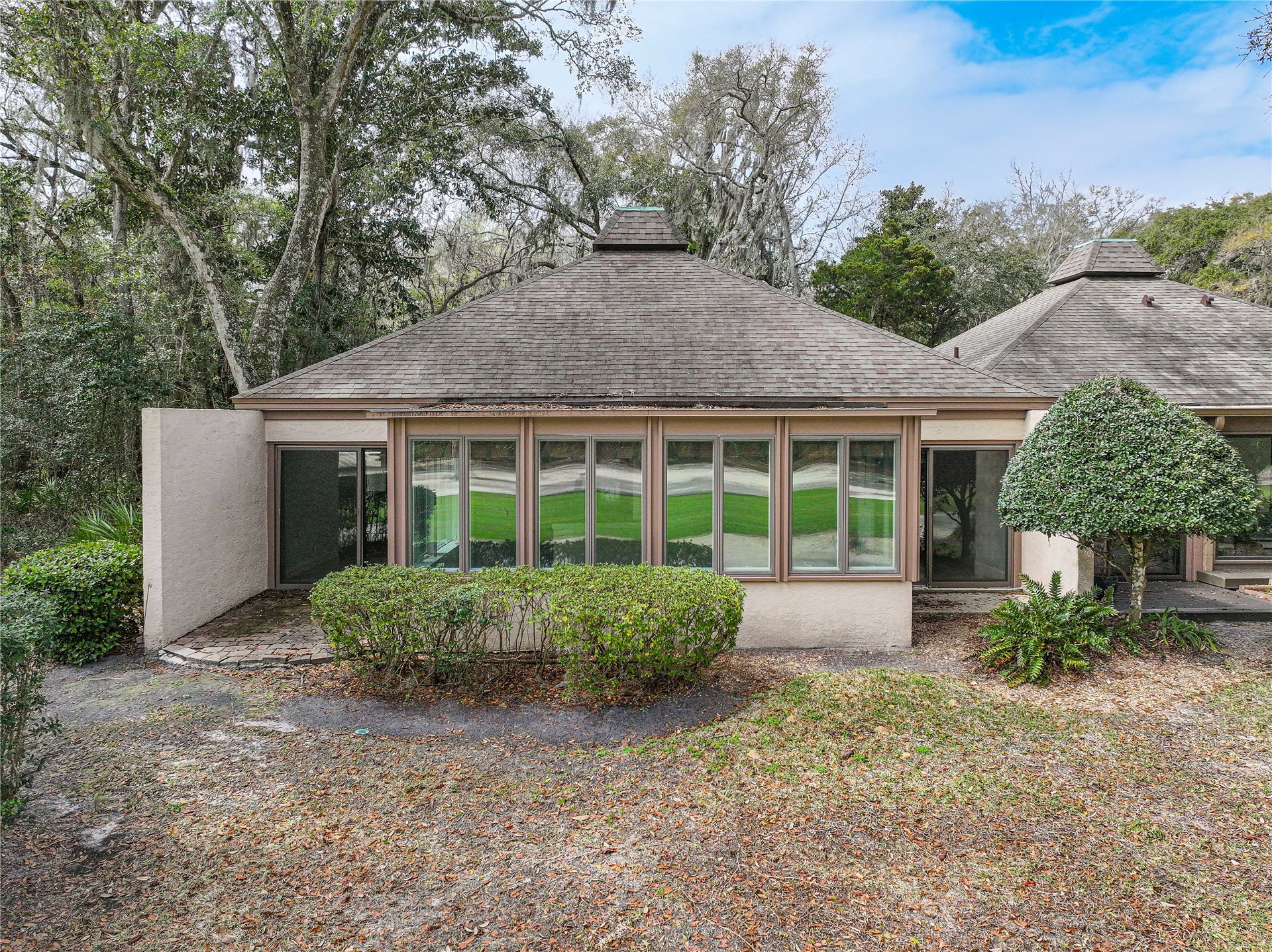 3301 Sea Marsh Road, Unit 3301 Amelia Island, FL 32034 - Photo 34 of 58 a front view of a house with garden and porch