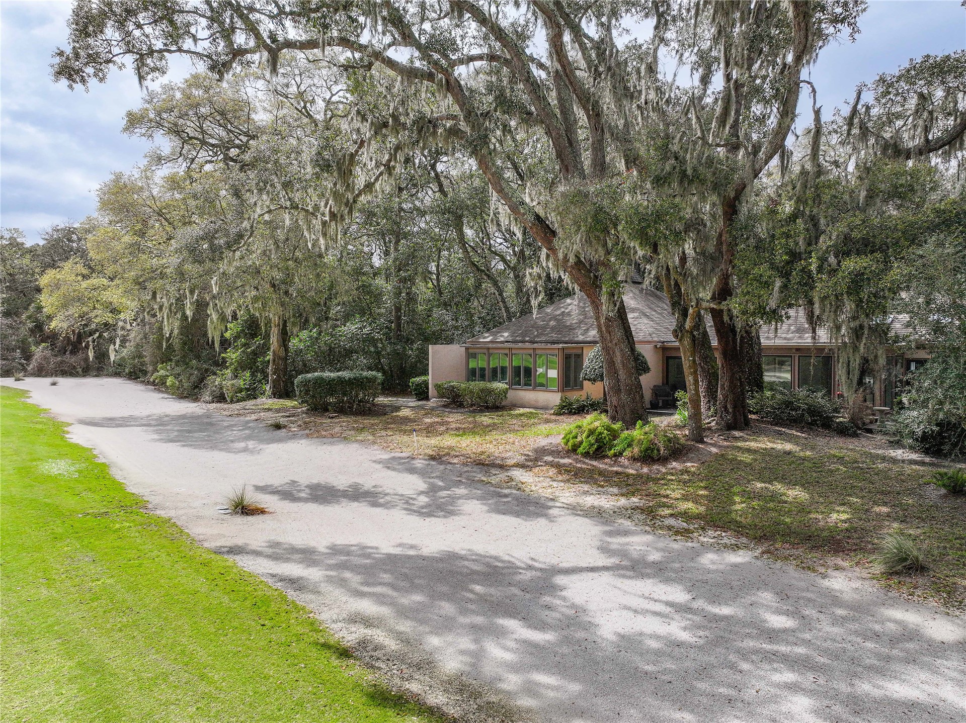 3301 Sea Marsh Road, Unit 3301 Amelia Island, FL 32034 - Photo 40 of 58 a view of a yard with plants and trees