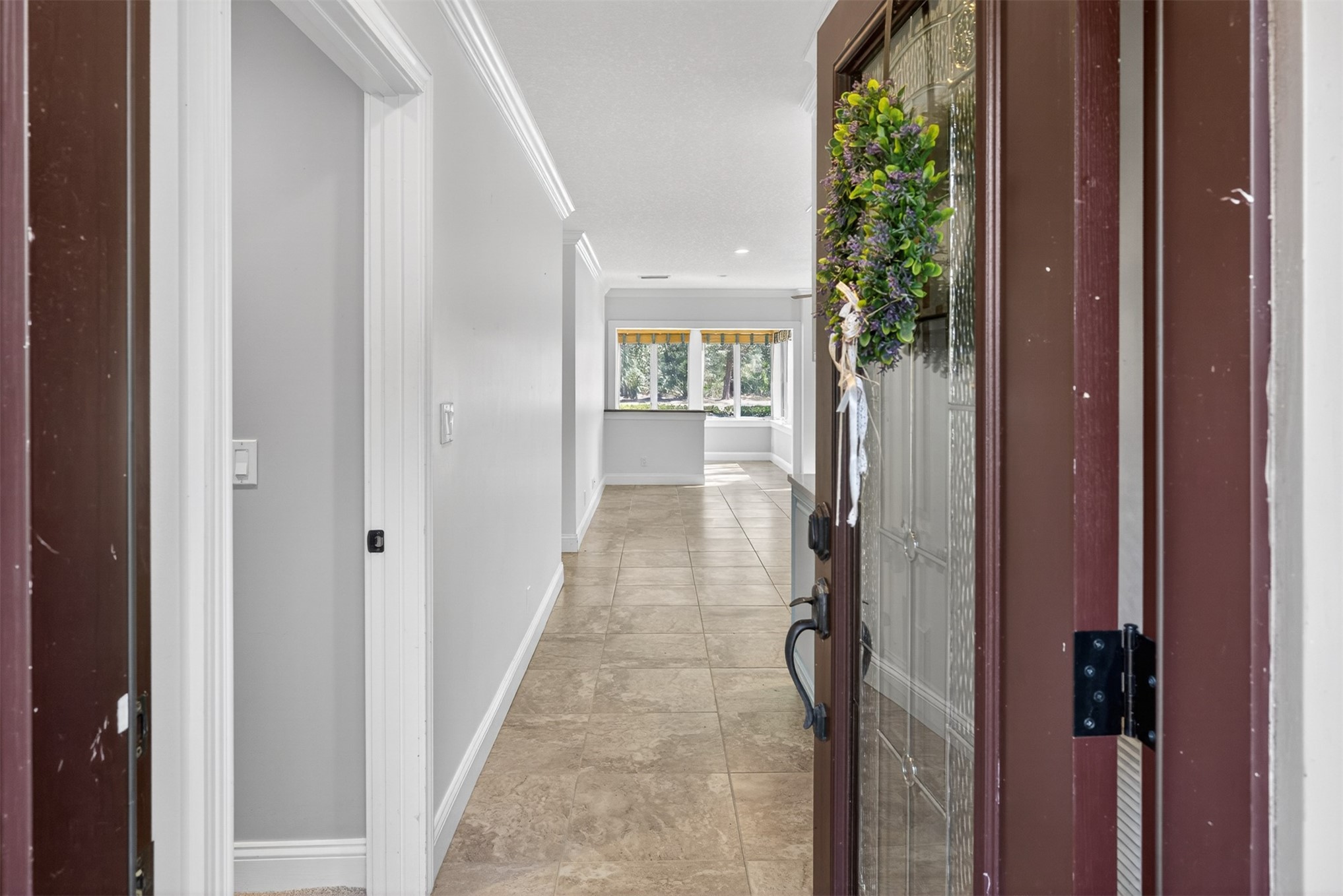 3301 Sea Marsh Road, Unit 3301 Amelia Island, FL 32034 - Photo 4 of 58 a view of a hallway with wooden floor and entryway