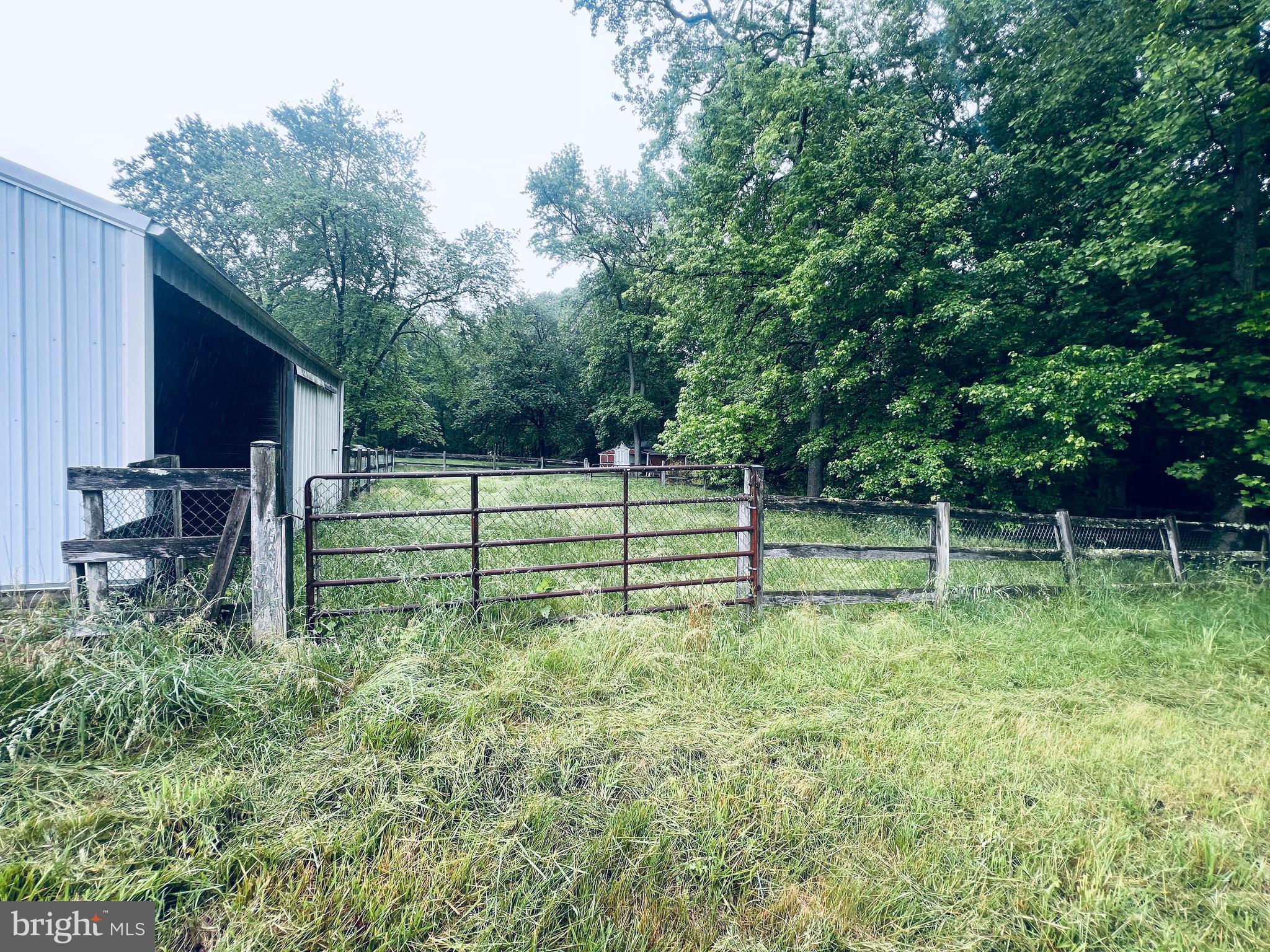 3629 Riva Road Davidsonville, MD 21035 - Photo 33 of 39 Rear of Barn with Run-In Shed & Small Paddock
