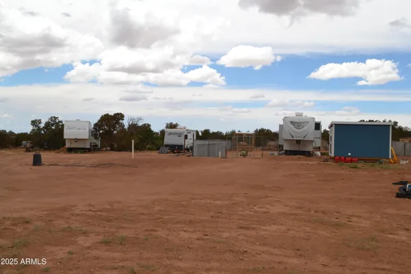 a kitchen with a refrigerator and a sink