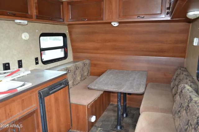 a kitchen with a refrigerator and a sink