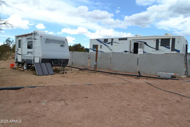 a living room with furniture and a chair
