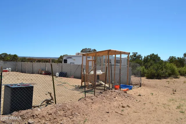 a view of a house with yard and sitting area