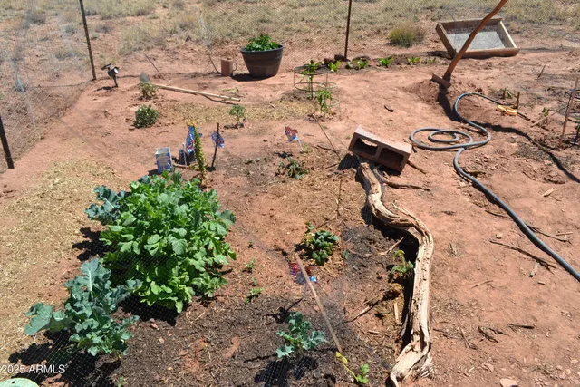 a view of wooden fence and a pathway