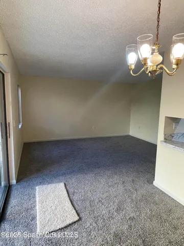 a view of a room with a fireplace