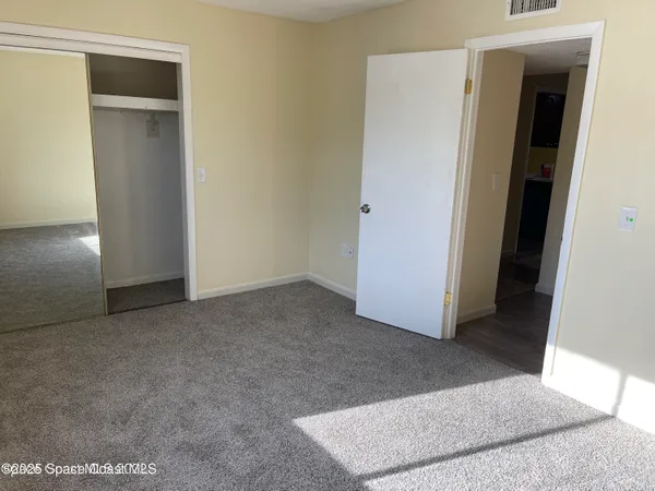 a view of a hallway with closet