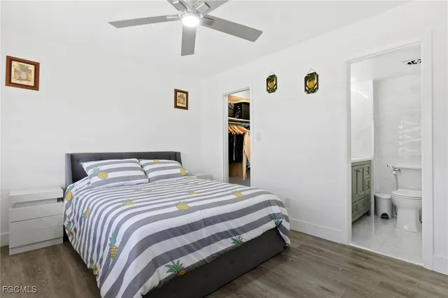 a bedroom with a bed and a view of bathroom