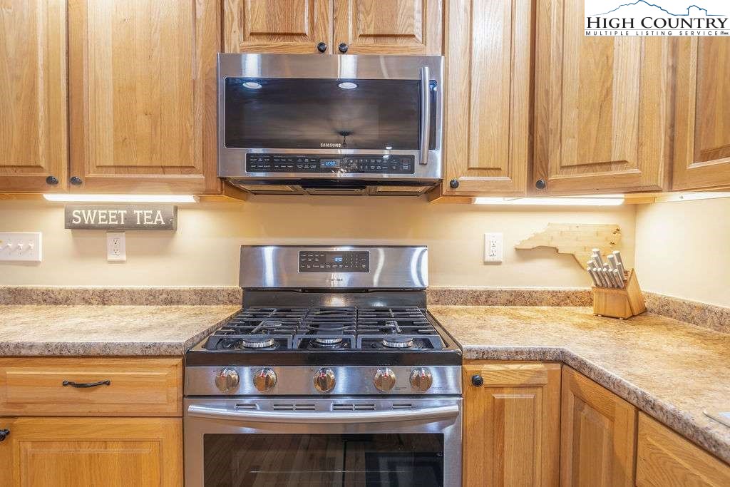 120 Ridge Road Newland, NC 28657 - Photo 17 of 40 a stove top oven sitting inside of a kitchen