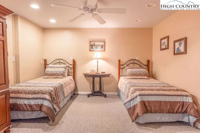 a bedroom with a bed and lamp