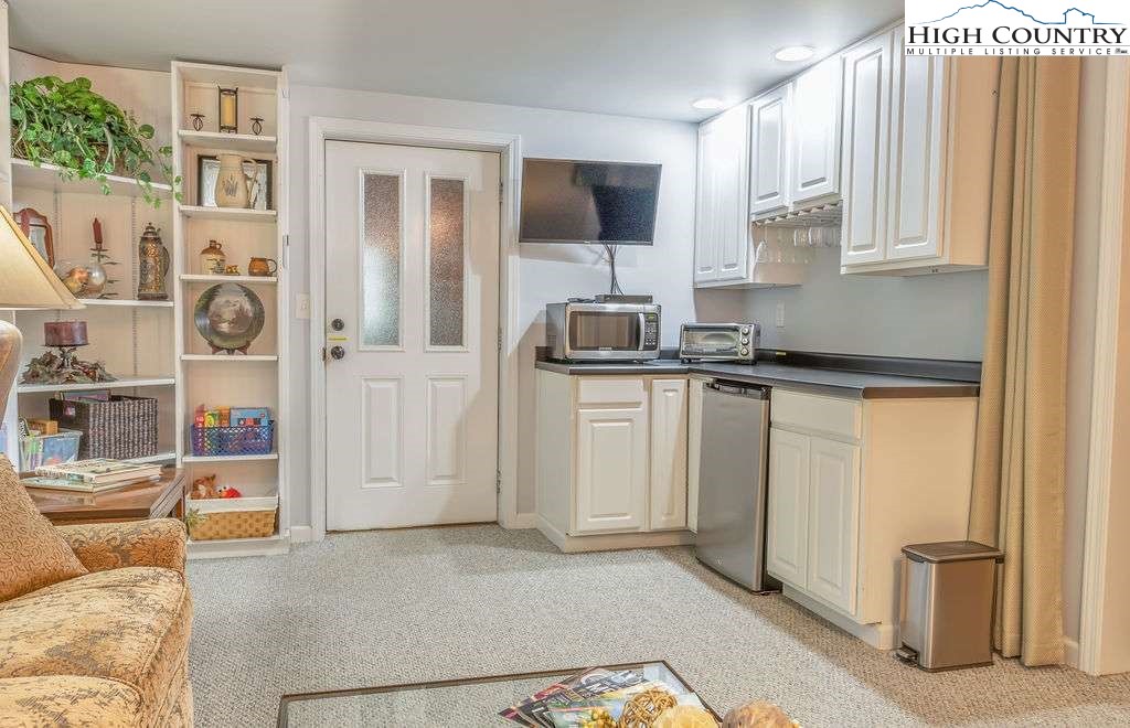 120 Ridge Road Newland, NC 28657 - Photo 23 of 40 a kitchen with stainless steel appliances granite countertop a refrigerator and a stove top oven