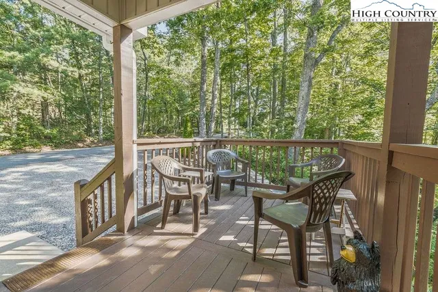 a view of a chairs and table in the balcony