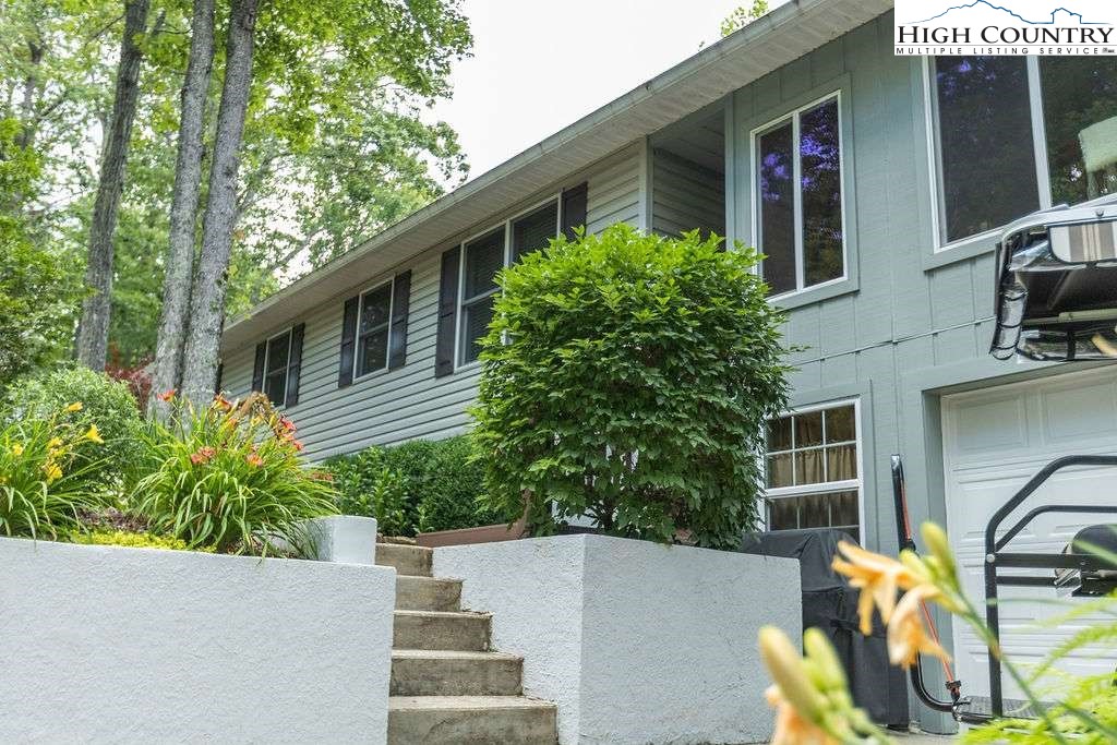 120 Ridge Road Newland, NC 28657 - Photo 31 of 40 front view of a house with potted plants