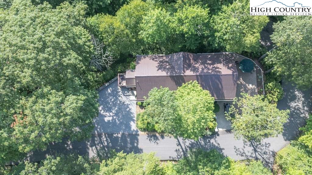 120 Ridge Road Newland, NC 28657 - Photo 33 of 40 an aerial view of a house with a yard and trees all around