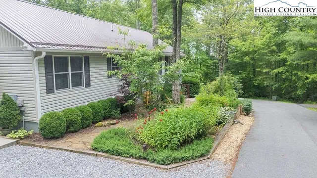 a view of a house with lots of trees
