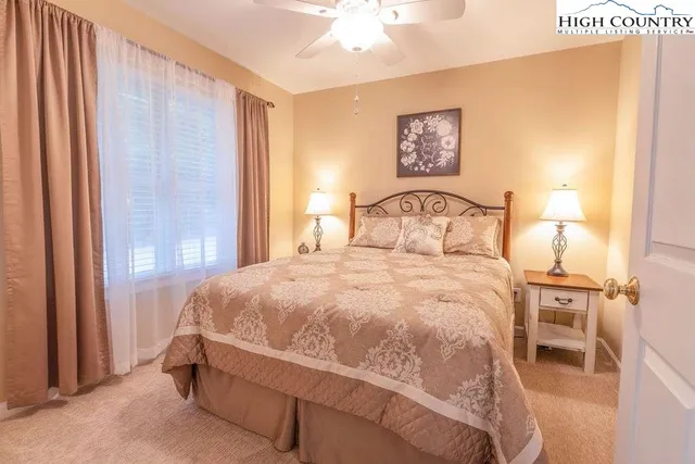 a bedroom with a bed and a table