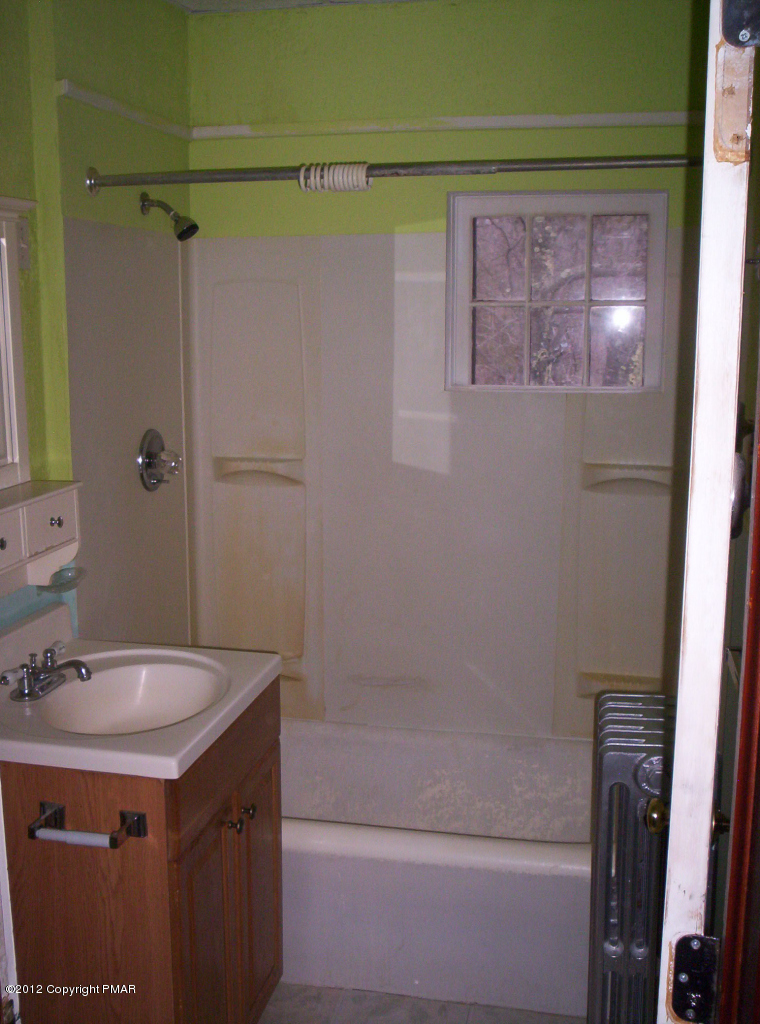 Grange Rd Mount Mount Pocono, PA 18344 - Photo 4 of 8 a bathroom with a sink and a mirror
