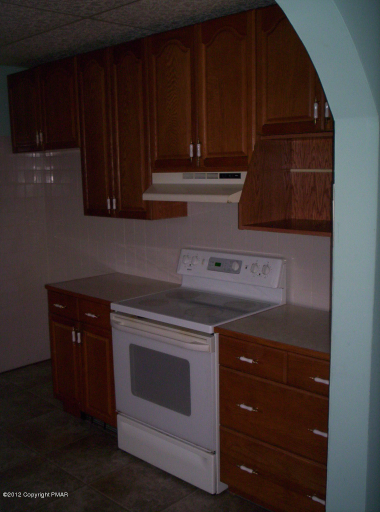 Grange Rd Mount Mount Pocono, PA 18344 - Photo 7 of 8 a stove top oven sitting inside of a kitchen