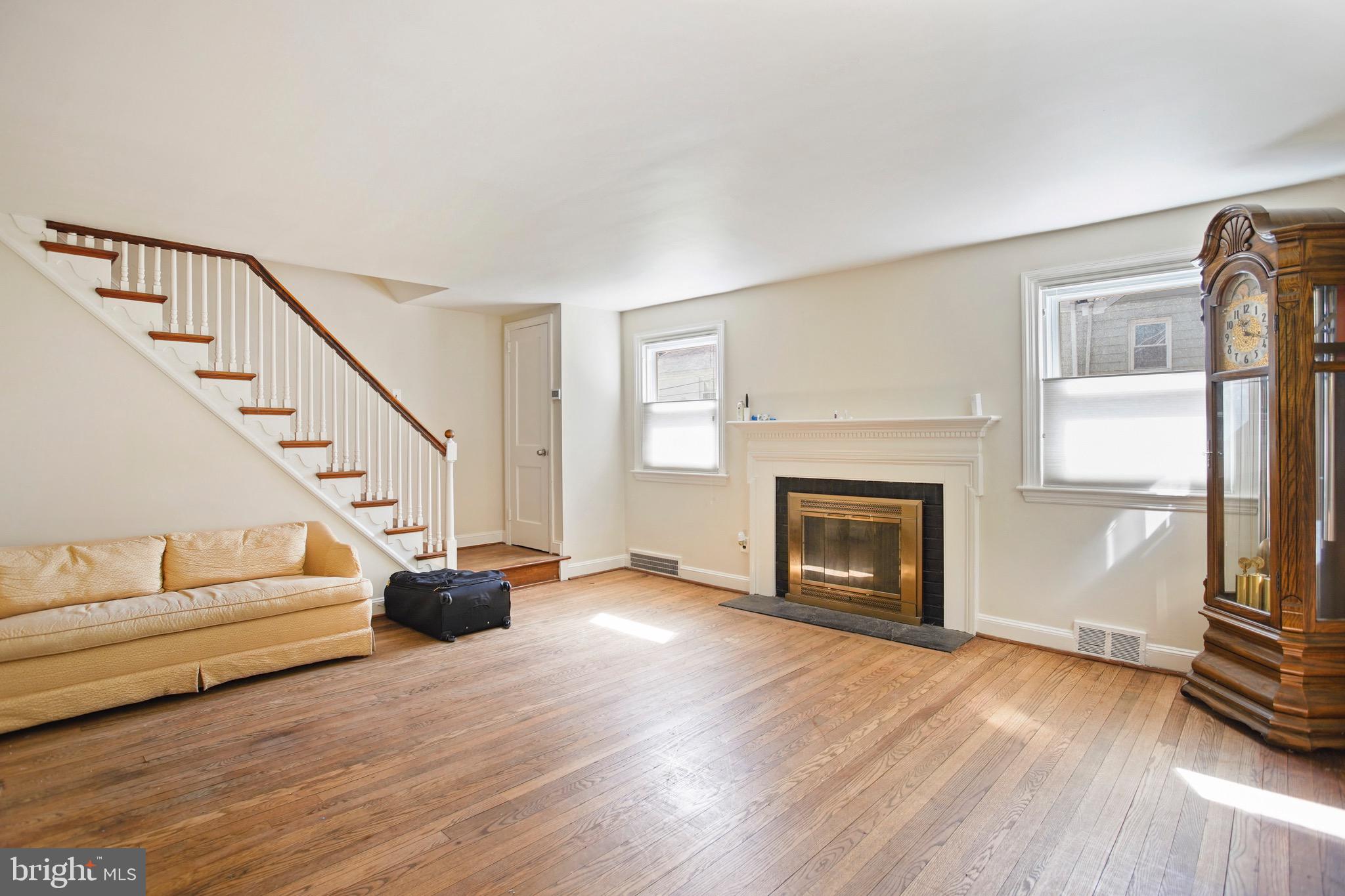 263 Henley Road Wynnewood, PA 19096 - Photo 7 of 23 Spacious family room with wood burning fireplace