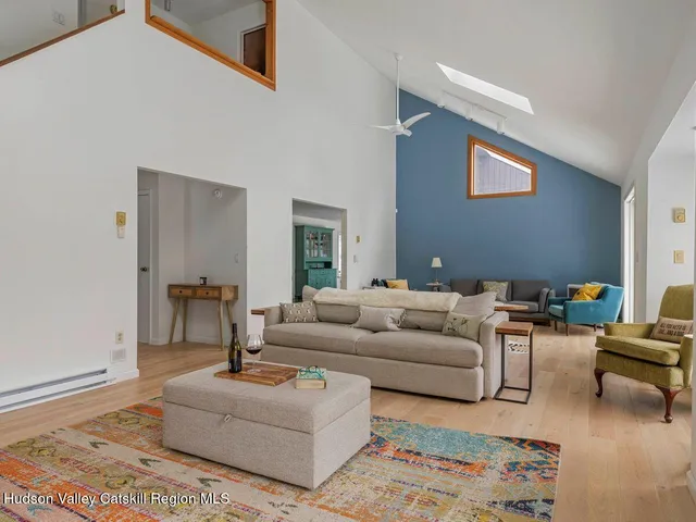 a living room with furniture and a rug