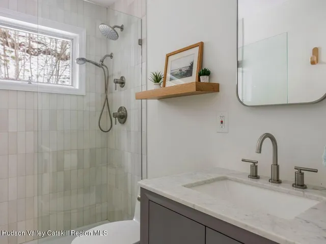 a bathroom with a sink and mirror