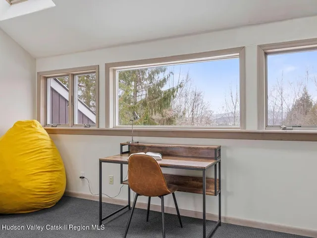 a view of a chair and table in a room