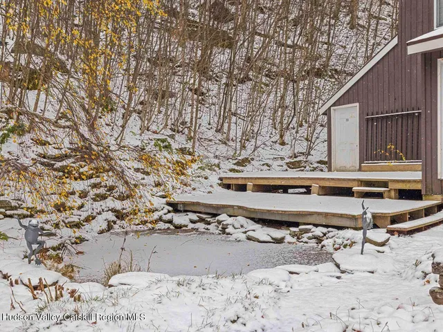 a view of balcony with wooden fence and trees
