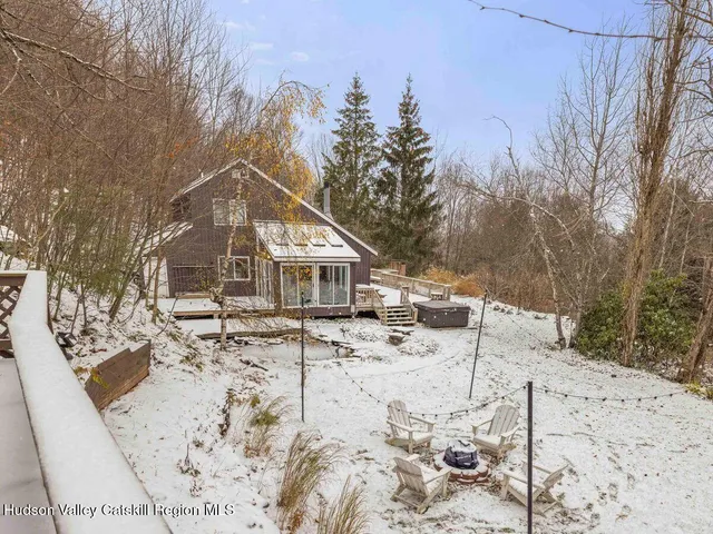 a view of house with a snow in the background