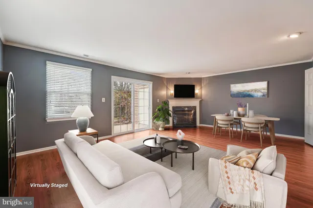 a kitchen with stainless steel appliances granite countertop white cabinets a stove a sink and dishwasher