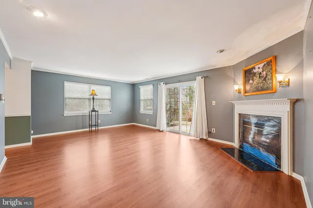 a kitchen with a sink a refrigerator and cabinets