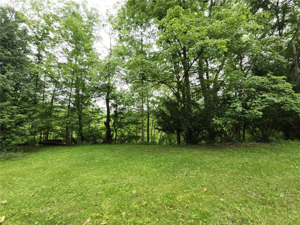 130 Keystone Road Herminie, PA 15637 - Photo 3 of 13 a view of a green field with trees in the background